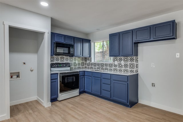 3945 Happy Canyon Dr, Dallas, TX 75241 - kitchen with black microwave, tasteful backsplash, a sink, and electric range oven