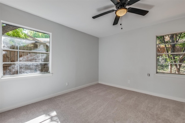 3945 Happy Canyon Dr, Dallas, TX 75241 - unfurnished room with light carpet, baseboards, and ceiling fan