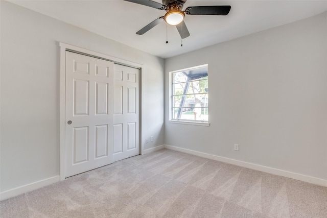 3945 Happy Canyon Dr, Dallas, TX 75241 - unfurnished bedroom featuring a closet, baseboards, light colored carpet, and ceiling fan