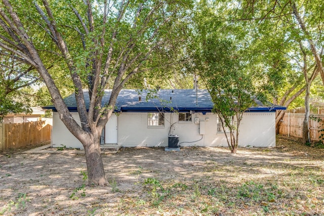 3945 Happy Canyon Dr, Dallas, TX 75241 - rear view of house featuring central air condition unit, fence, and brick siding