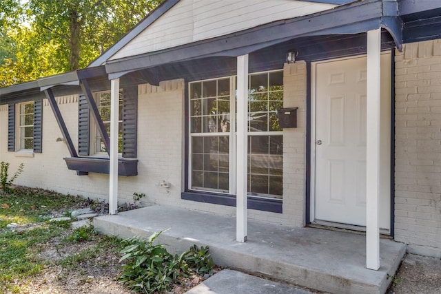 3945 Happy Canyon Dr, Dallas, TX 75241 - view of exterior entry with covered porch and brick siding