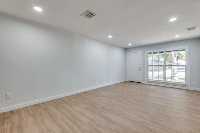 3945 Happy Canyon Dr, Dallas, TX 75241 - empty room featuring baseboards, visible vents, and light wood-style floors