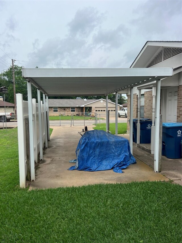 800 Humphrey St, Athens, TX 75751 - view of parking / parking lot with fence and a carport