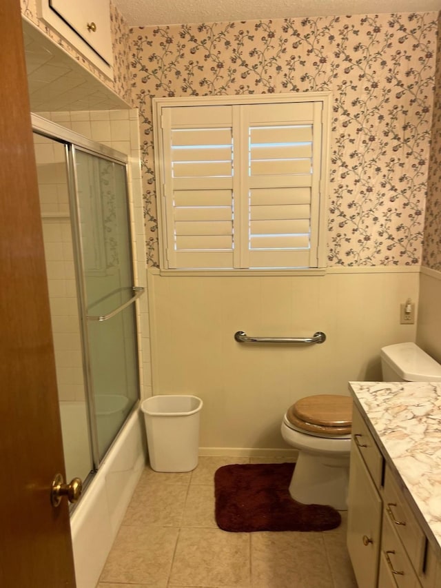 800 Humphrey St, Athens, TX 75751 - bathroom featuring vanity, toilet, wainscoting, a textured ceiling, and wallpapered walls