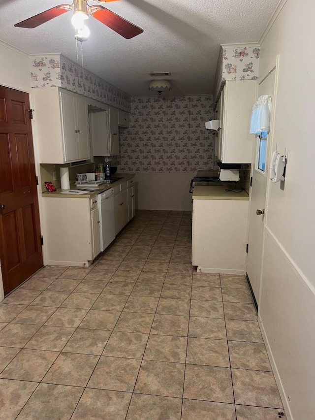 800 Humphrey St, Athens, TX 75751 - kitchen with a textured ceiling, white dishwasher, a ceiling fan, and wallpapered walls