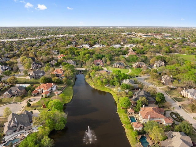 drone / aerial view featuring a water view and a residential view