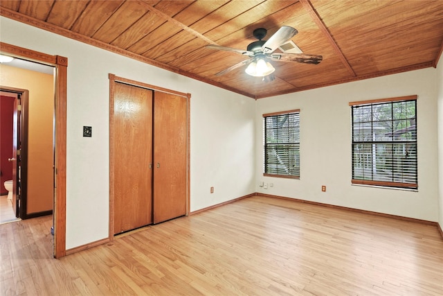 7220 Amy St, Dallas, TX 75217 - unfurnished bedroom featuring a closet, light wood finished floors, baseboards, ceiling fan, and wood ceiling