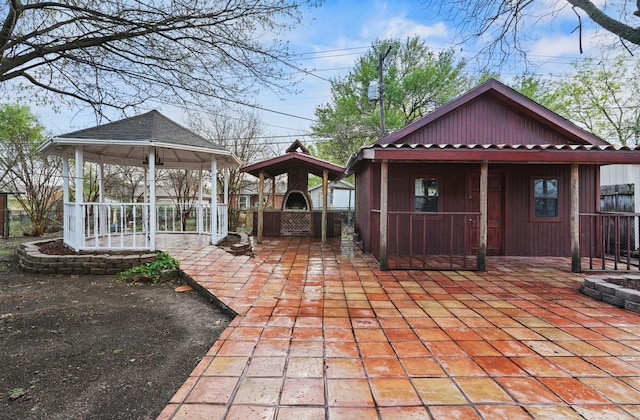 7220 Amy St, Dallas, TX 75217 - view of patio / terrace with a gazebo, a gate, and fence