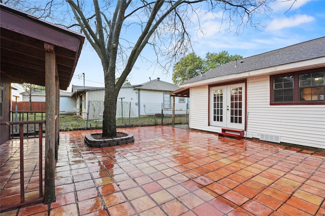 7220 Amy St, Dallas, TX 75217 - view of patio / terrace featuring visible vents, fence, and french doors