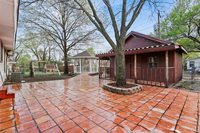 7220 Amy St, Dallas, TX 75217 - view of patio / terrace with fence, a gazebo, and central AC unit