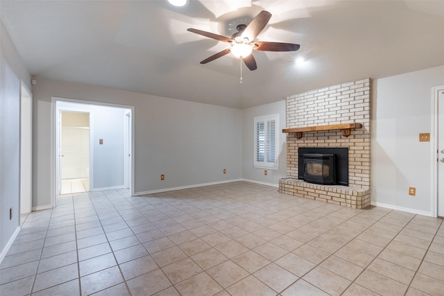 unfurnished living room featuring light tile patterned floors, baseboards, a ceiling fan, and lofted ceiling