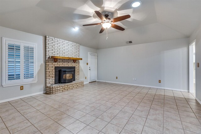 unfurnished living room featuring baseboards, vaulted ceiling, light tile patterned floors, a ceiling fan, and visible vents