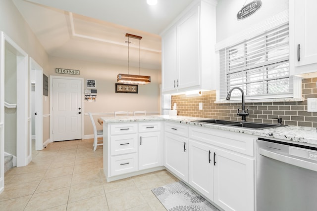 1609 W Alamosa Dr, Talty, TX 75160 - kitchen with dishwasher, a sink, decorative backsplash, white cabinets, and a peninsula