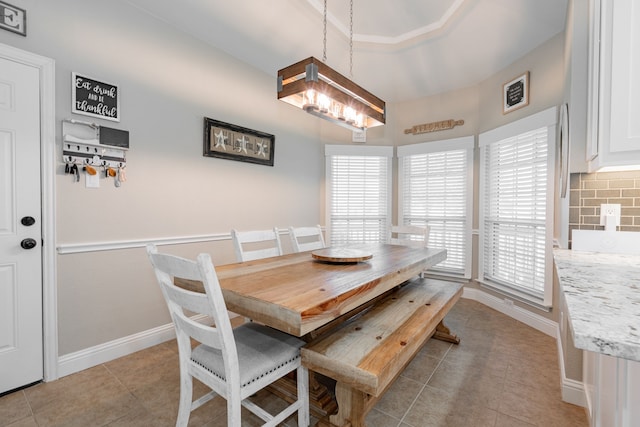 1609 W Alamosa Dr, Talty, TX 75160 - dining room featuring light tile patterned floors, a chandelier, and baseboards