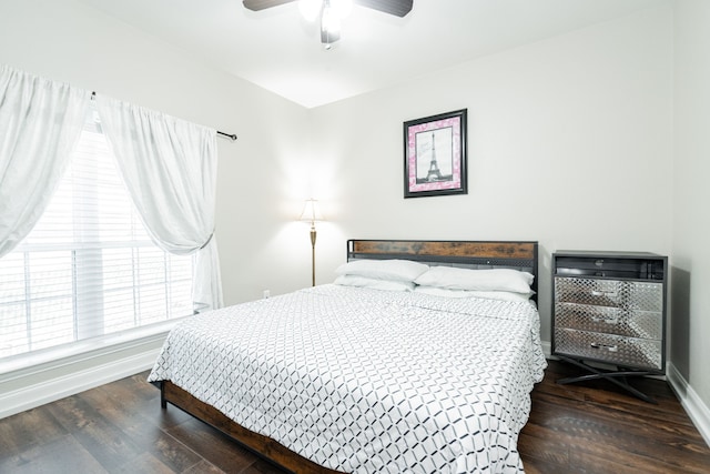 1609 W Alamosa Dr, Talty, TX 75160 - bedroom featuring baseboards, heating unit, wood finished floors, and ceiling fan