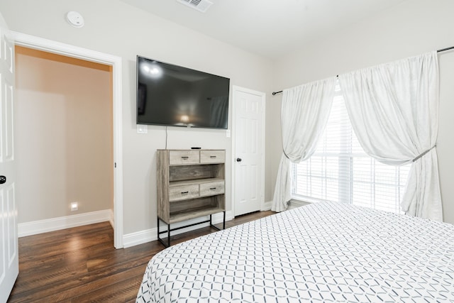 1609 W Alamosa Dr, Talty, TX 75160 - bedroom featuring dark wood finished floors and baseboards