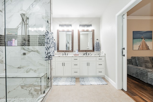 1609 W Alamosa Dr, Talty, TX 75160 - ensuite bathroom featuring a marble finish shower, ornamental molding, and double vanity