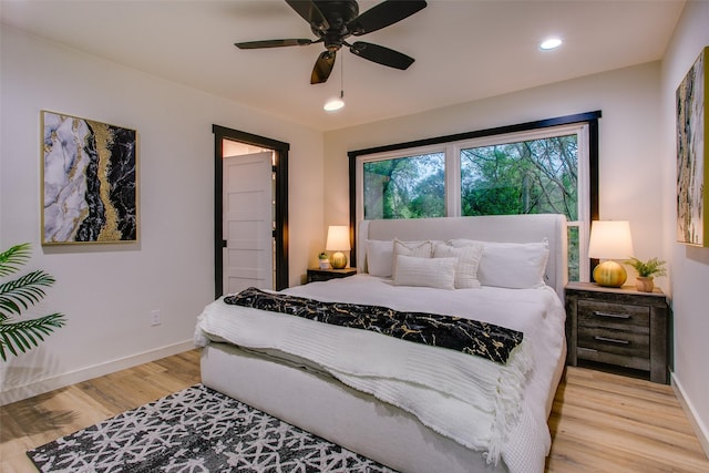bedroom featuring a ceiling fan, light wood-style flooring, baseboards, and recessed lighting