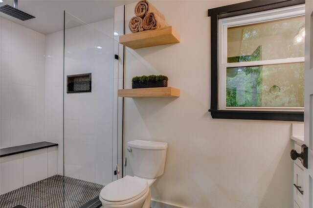 full bathroom featuring visible vents, toilet, and a tile shower