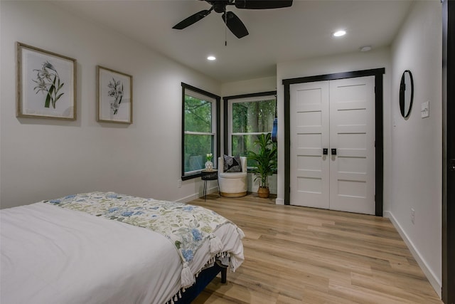 bedroom with a ceiling fan, baseboards, light wood-style floors, and recessed lighting
