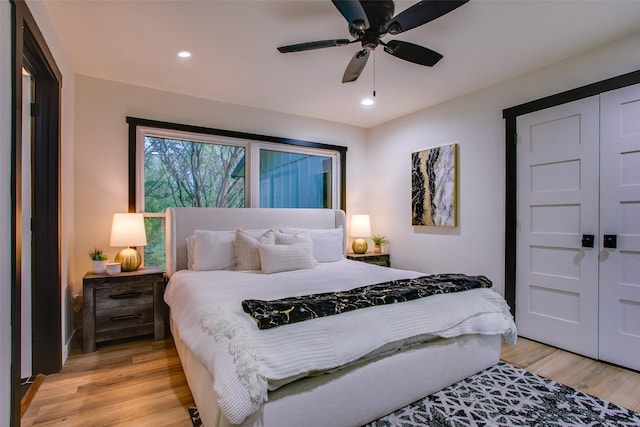 bedroom featuring a ceiling fan, recessed lighting, and light wood-type flooring
