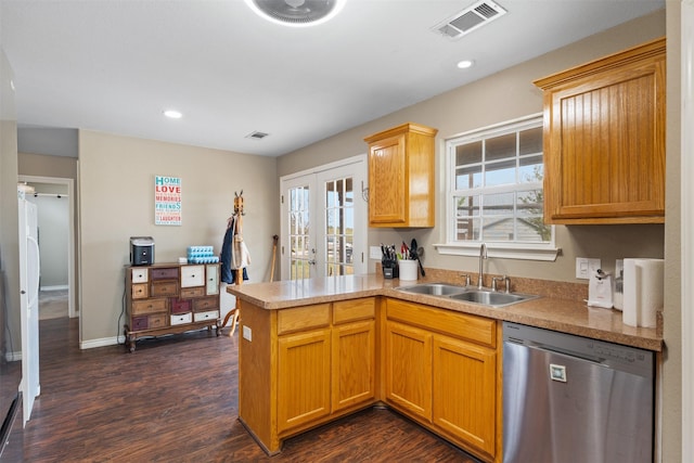kitchen with visible vents, a peninsula, dishwasher, a sink, and french doors