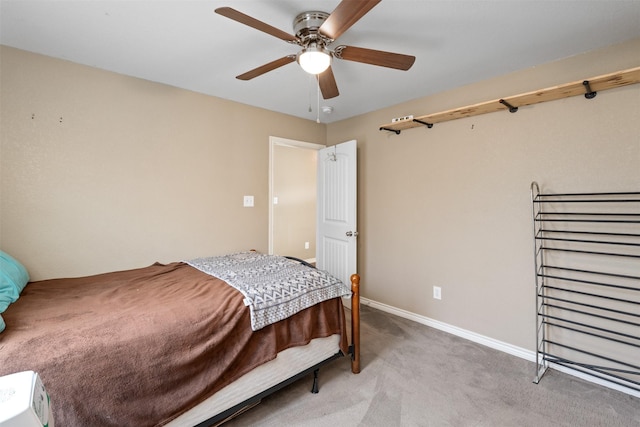 bedroom with light carpet, baseboards, and ceiling fan