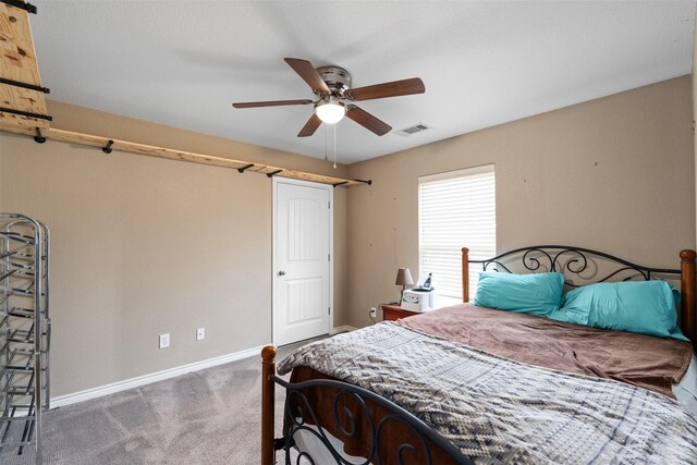1493 County Road 3555, Paradise, TX 76073 - bedroom with light carpet, baseboards, and a ceiling fan