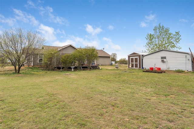 view of yard with an outbuilding and a storage shed