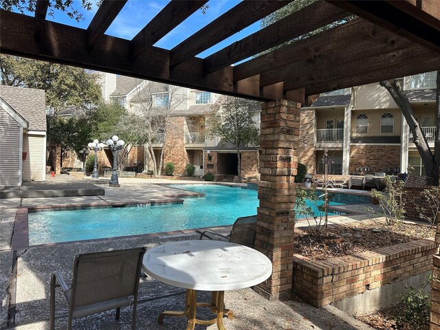 exterior space with a shingled roof, french doors, and a patio