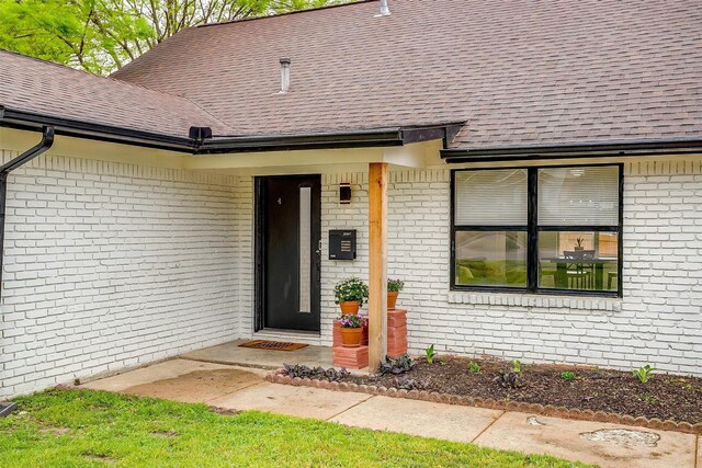 3113 Westfield Ave, Fort Worth, TX 76133 - doorway to property featuring brick siding and a shingled roof