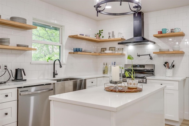 3113 Westfield Ave, Fort Worth, TX 76133 - kitchen with white cabinetry, tasteful backsplash, open shelves, wall chimney range hood, and appliances with stainless steel finishes