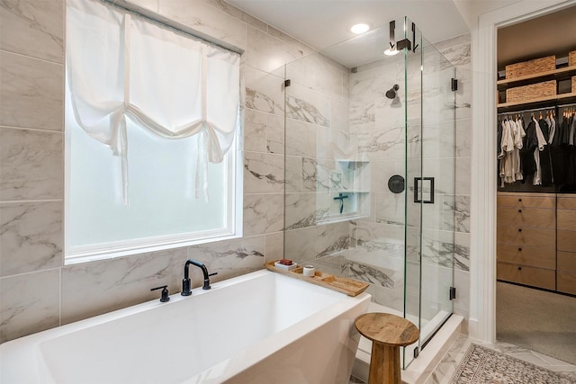 1512 Trailblazer Way, Northlake, TX 76247 - bathroom featuring a bath, a shower stall, a spacious closet, and tile walls