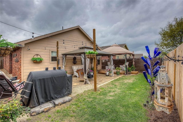 4036 Eagle Dr, Forney, TX 75126 - back of property featuring a patio, a fenced backyard, a gazebo, and a yard