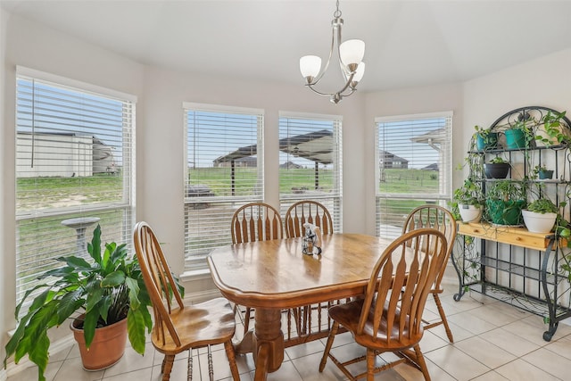 7203 Veal Station Rd, Weatherford, TX 76085 - dining space with baseboards, an inviting chandelier, and light tile patterned floors