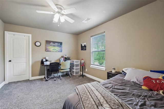 carpeted bedroom featuring baseboards, ceiling fan, and visible vents