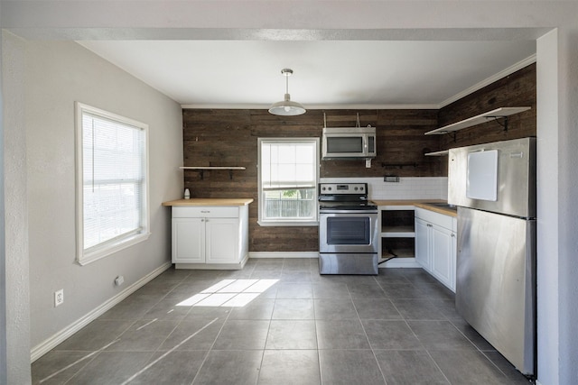 kitchen featuring white cabinets, stainless steel appliances, and open shelves
