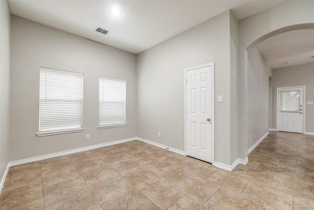 9212 Water Oak Dr, Arlington, TX 76002 - unfurnished room featuring arched walkways and baseboards