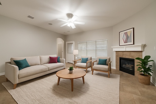 9212 Water Oak Dr, Arlington, TX 76002 - living area with a ceiling fan, a tiled fireplace, and baseboards