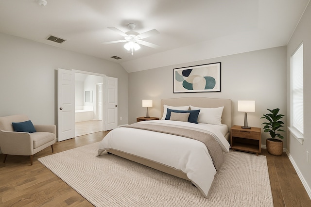 9212 Water Oak Dr, Arlington, TX 76002 - bedroom with wood finished floors, ensuite bathroom, baseboards, ceiling fan, and lofted ceiling
