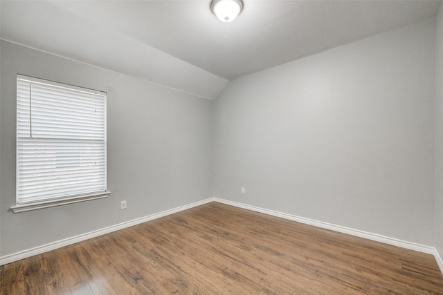9212 Water Oak Dr, Arlington, TX 76002 - unfurnished room with lofted ceiling, baseboards, and wood finished floors