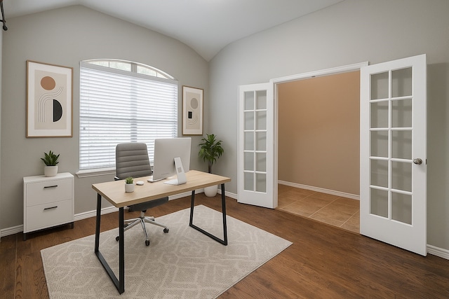 9212 Water Oak Dr, Arlington, TX 76002 - home office with french doors, healthy amount of natural light, lofted ceiling, wood finished floors, and baseboards