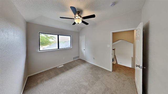 unfurnished bedroom with visible vents, carpet, and a textured ceiling