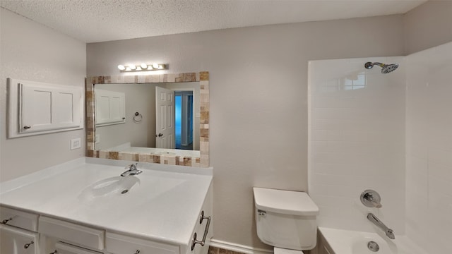 bathroom featuring a textured ceiling, bathtub / shower combination, toilet, vanity, and a textured wall