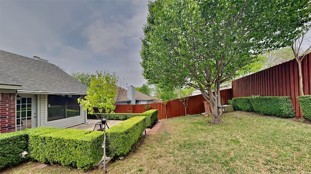 view of yard with a fenced backyard and a patio