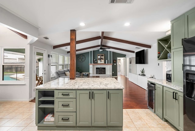 1417 Northridge Dr, Carrollton, TX 75006 - kitchen with beverage cooler, open shelves, a ceiling fan, and green cabinets