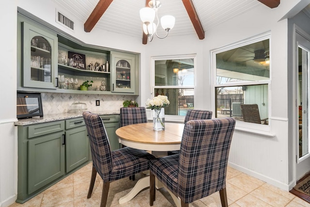 1417 Northridge Dr, Carrollton, TX 75006 - dining space featuring ceiling fan with notable chandelier, wooden ceiling, light tile patterned floors, beamed ceiling, and visible vents