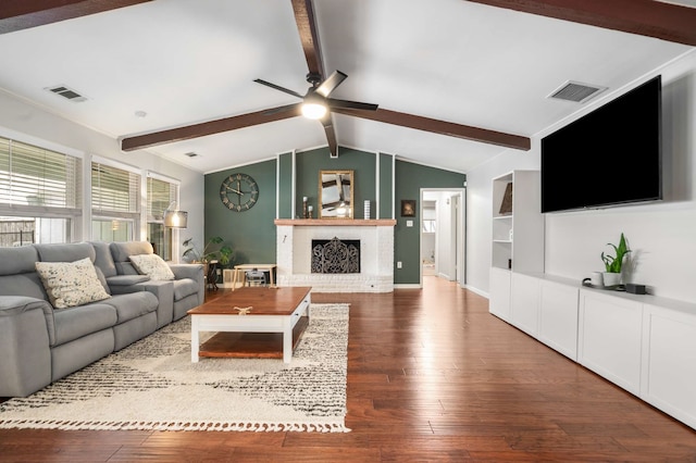 1417 Northridge Dr, Carrollton, TX 75006 - living room with visible vents, lofted ceiling with beams, and hardwood / wood-style floors