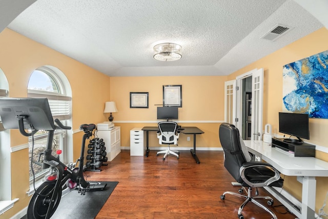 1417 Northridge Dr, Carrollton, TX 75006 - office space with visible vents, a textured ceiling, and wood finished floors