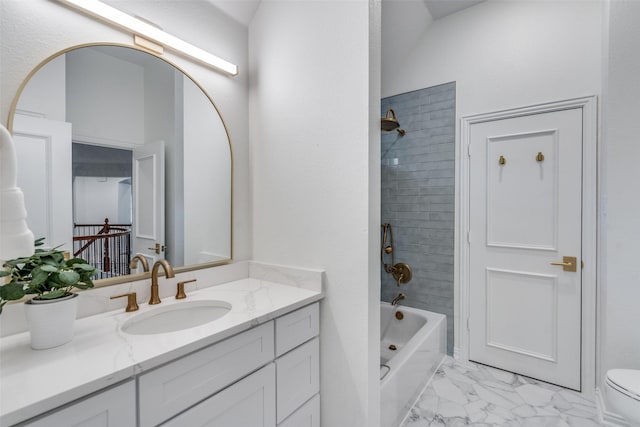 full bath with marble finish floor, vanity, shower / washtub combination, and toilet
